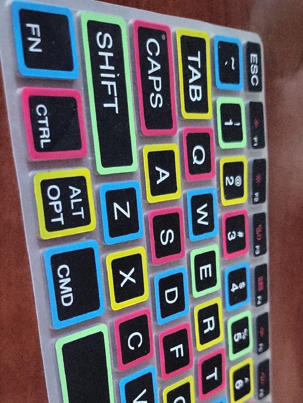 silicone keyboard cover for MacBook Pro and Air features a black layout with lar